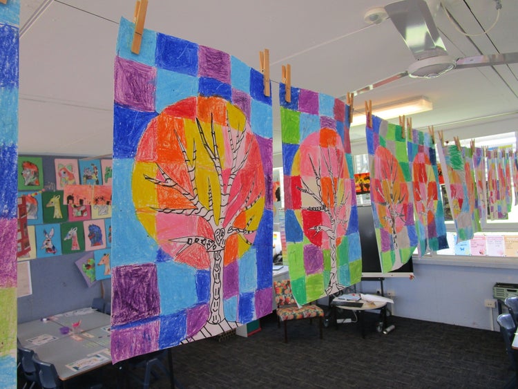 photo of colourful artwork hung in a classroom